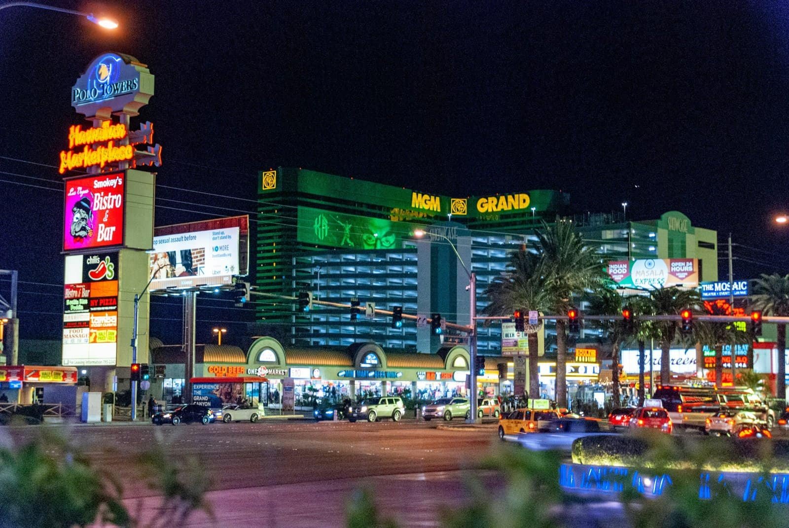 Night view of the Las Vegas Strip featuring the brightly lit MGM Grand, neon signs, palm trees, and busy traffic—highlighting Las Vegas as one of the best vacation sites in the USA.